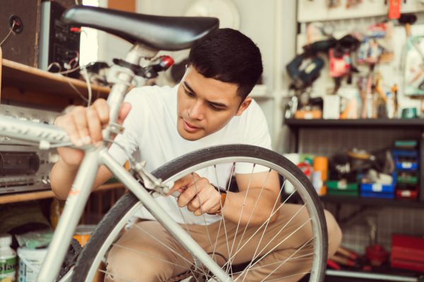 Man repairing bicycle
