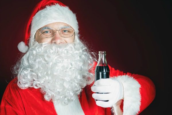 Santa holding coke bottle